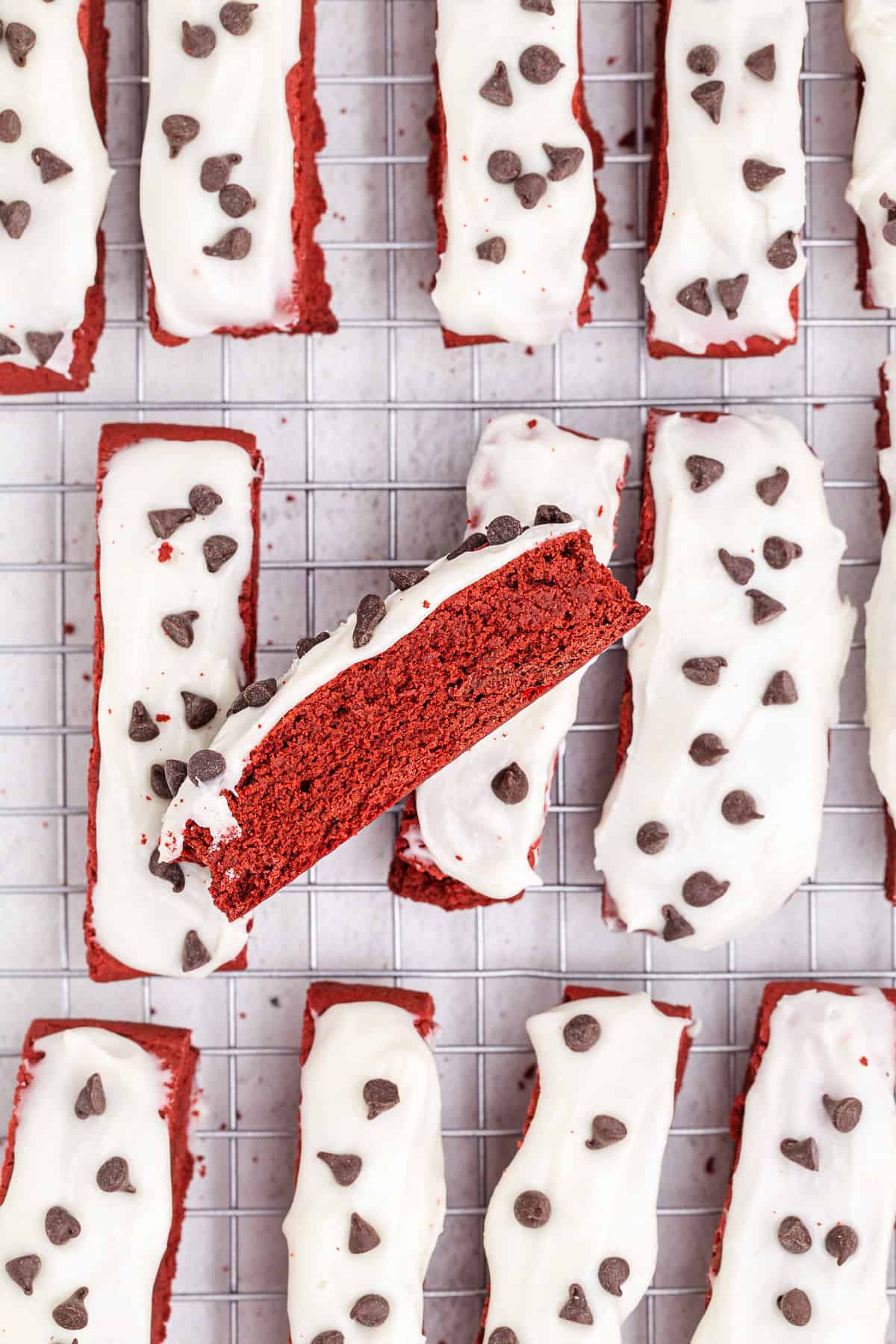 Red velvet biscotti on cooling rack.