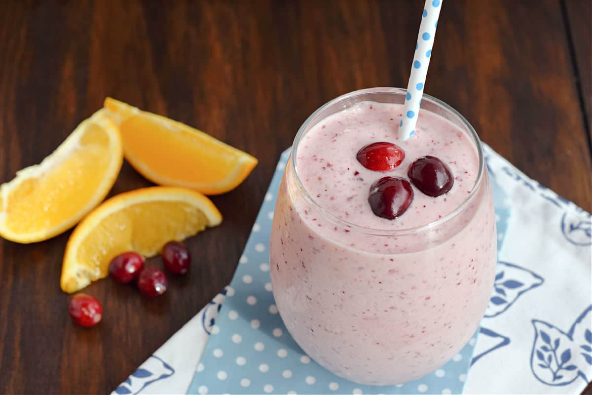 Fresh cranberry and orange smoothie in a glass.