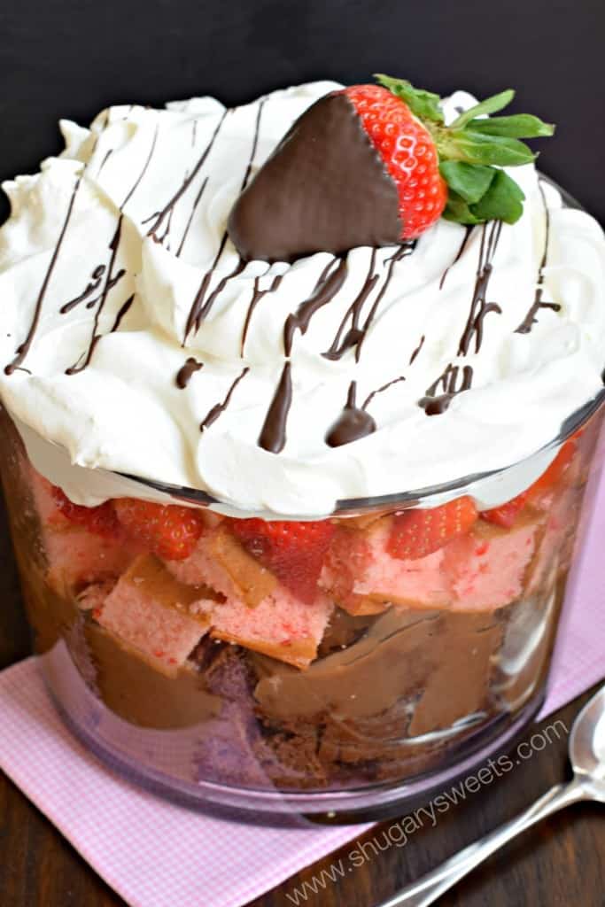 Easy Neapolitan Trifle recipe: layers of chocolate cake, pudding, strawberry cake, fresh berries and Cool Whip!