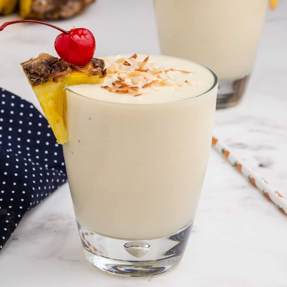 Get a taste of summer with this refreshing Pina Colada Smoothie. Packed with flavor and protein, it's a fabulous workout recovery smoothie or poolside sipper.