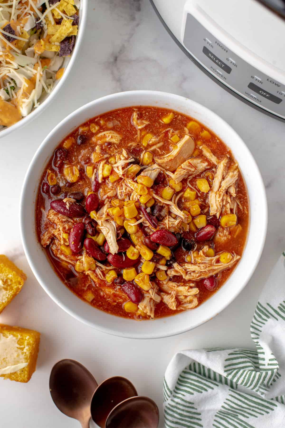 Chicken taco chili in a white bowl.