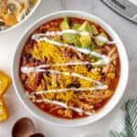 Slow Cooker Chicken Taco Chili is the answer to "what's for dinner?" With an abundance of tex mex spices and tender chicken, this tasty chili is going to be hit in your home. I know it!