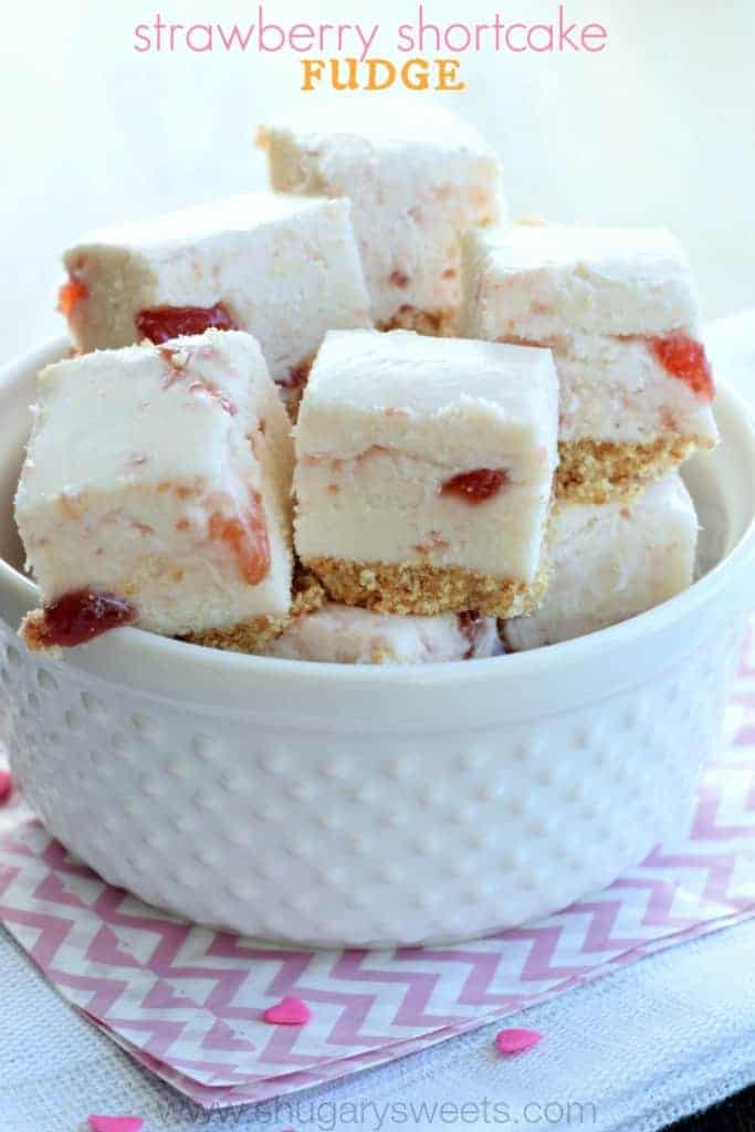 Strawberry Shortcake Fudge: a sweet fudge with a cookie crust, and strawberry preserves swirled into a creamy white chocolate fudge!