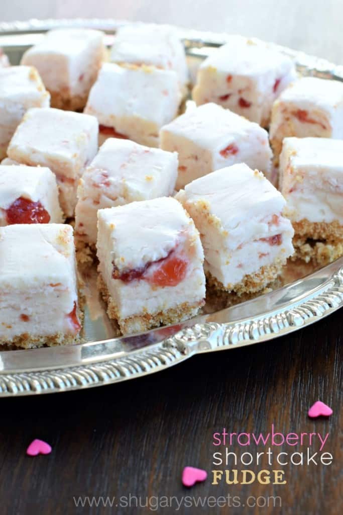 Strawberry Shortcake Fudge: a sweet fudge with a cookie crust, and strawberry preserves swirled into a creamy white chocolate fudge!