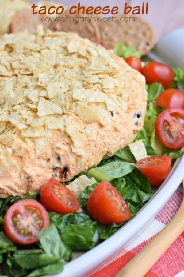 Easy Taco Cheese ball recipe is perfect for game day or potlucks! Roll the zesty cheese ball in crushed tortilla chips for an extra crunch!