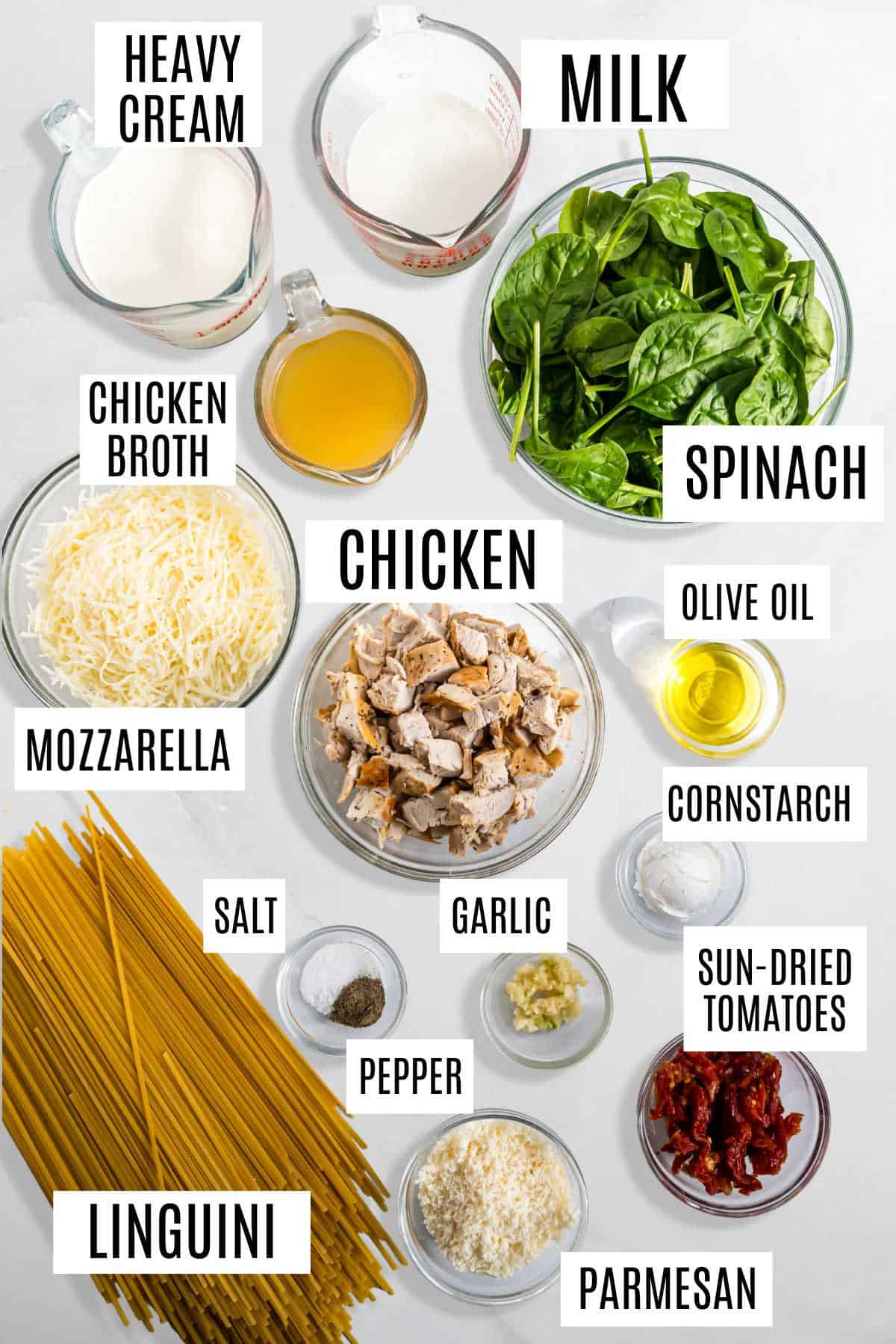 Ingredients for a creamy Italian chicken casserole pasta dish, labeled and arranged on a white background.