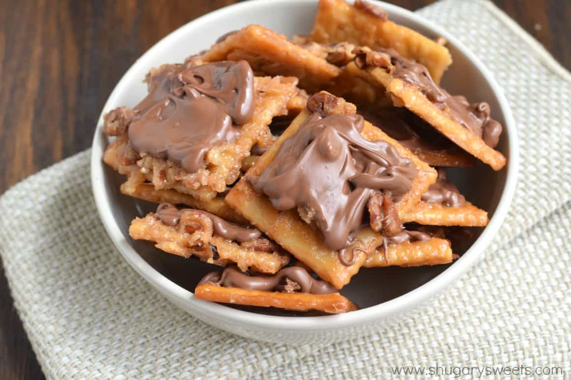 Saltine toffee squares in a white bowl.