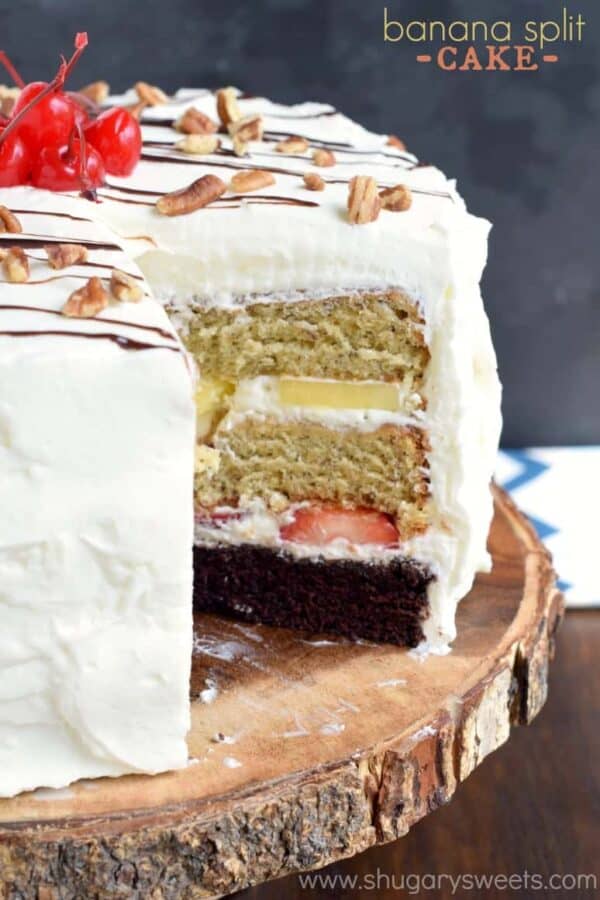 Banana Split Cake: layers of chocolate cake, banana cake, fresh fruit and whipped cream frosting for an ultimate, decadent cake recipe!