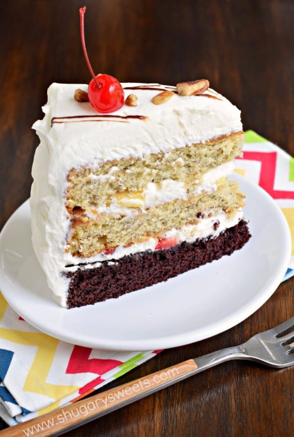 Banana Split Cake: layers of chocolate cake, banana cake, fresh fruit and whipped cream frosting for an ultimate, decadent cake recipe!