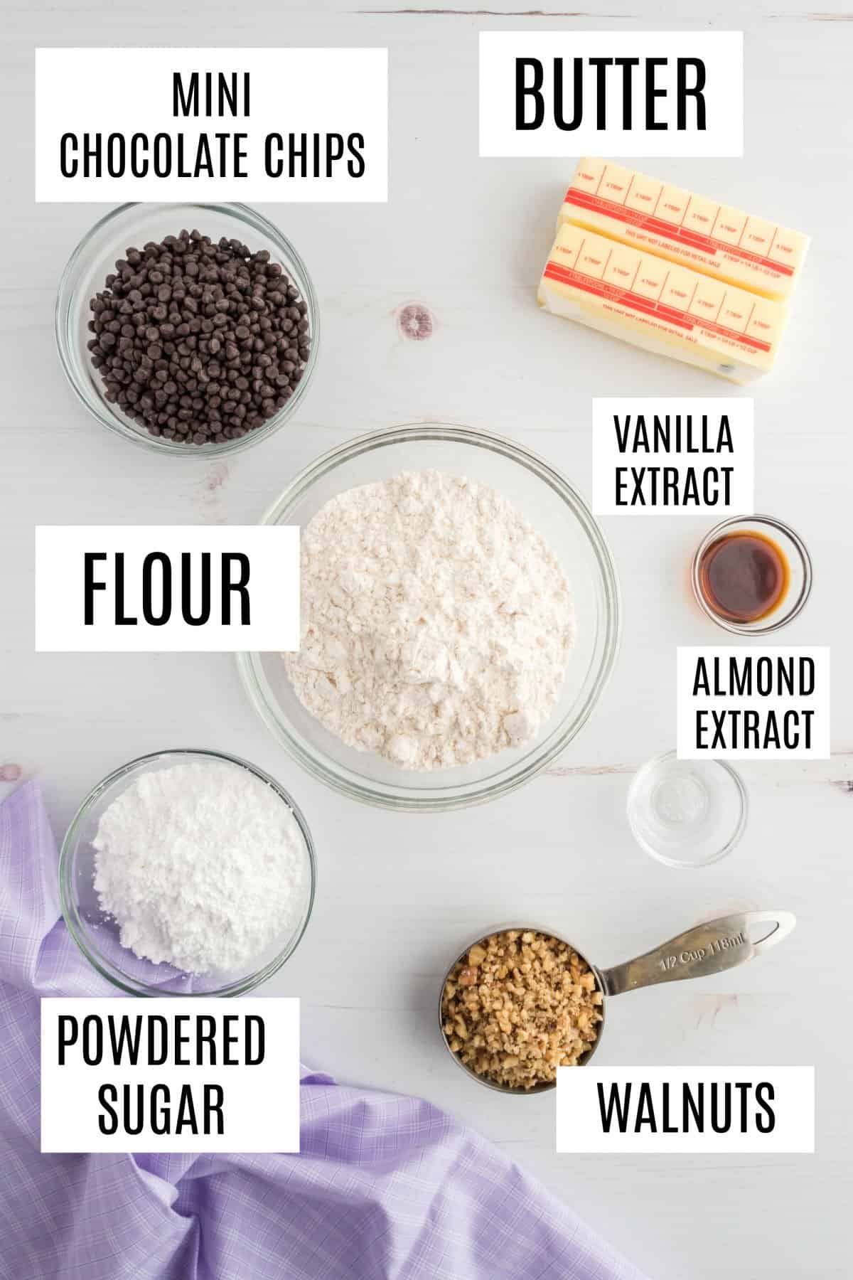 Ingredients to make chocolate chip shortbread cookies with nuts.