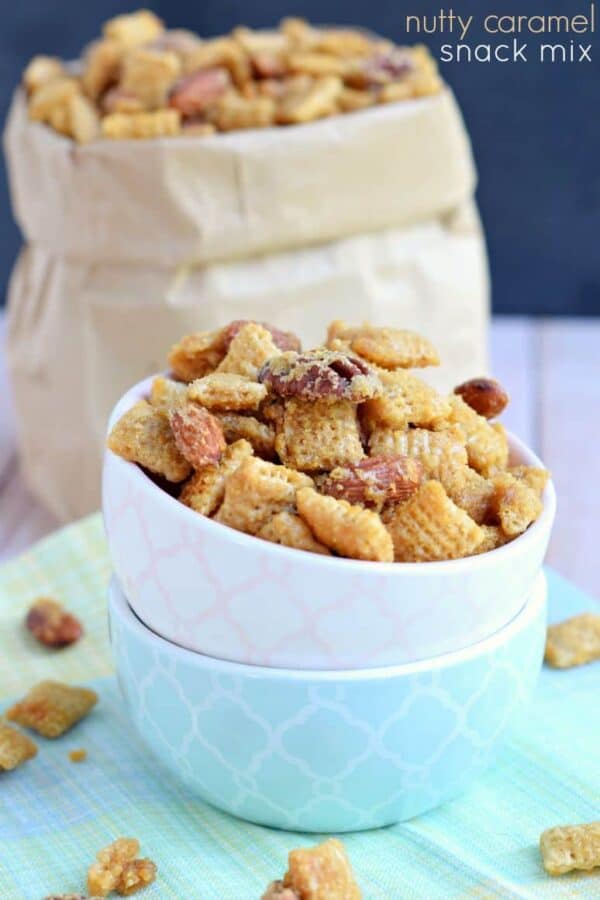 Nutty caramel snack mix in a stack of bowls.