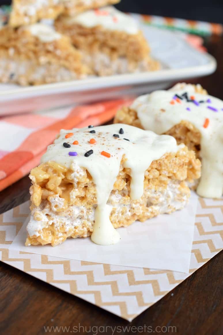 Pumpkin spice rice krispie treat topped with white chocolate and halloween sprinkles.