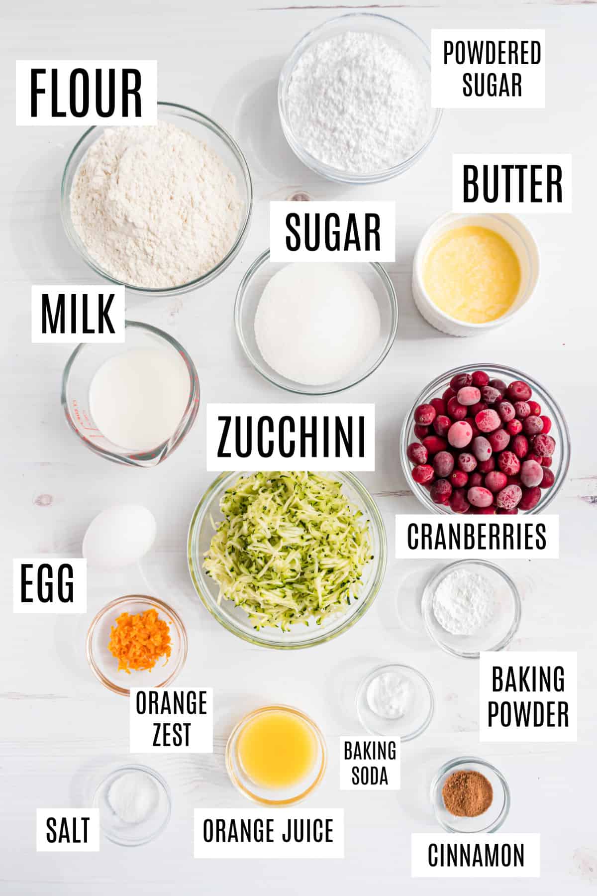 Ingredients needed to make cranberry orange zucchini muffins.