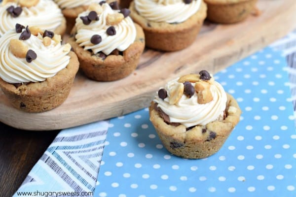 These easy and delicious Snickers Cookie Cups start with refrigerated cookie dough and candy bars. Topped with a sweet caramel frosting, they are sure to be a hit!