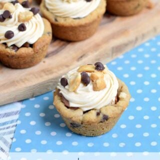 Easy Snickers Cookie Cups made with refrigerated cookie dough and candybars. Take the extra step and make the caramel frosting, so
