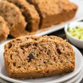 Crunchy Streusel Zucchini Bread is chock full of walnuts and zucchini. The sweet brown sugar topping and cinnamon crumb put this loaf over the top! You need a slice or two of this with your morning coffee.