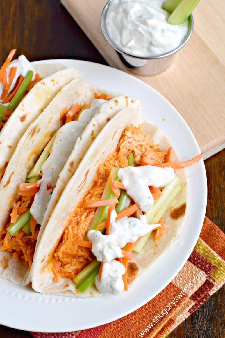 These delicious Buffalo Chicken Tacos are a cinch to put together! Cook up some shredded chicken in your slow cooker tonight, then whip up some of my homemade blue cheese dressing! A fun twist on a game day classic!