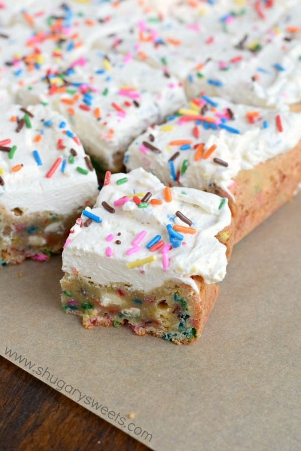 Frosted Funfetti Blondies!! Chewy blondies loaded with colorful sprinkles and topped with a creamy vanilla frosting (with more sprinkles of course)! A fun treat that can be made festive with any color sprinkle.