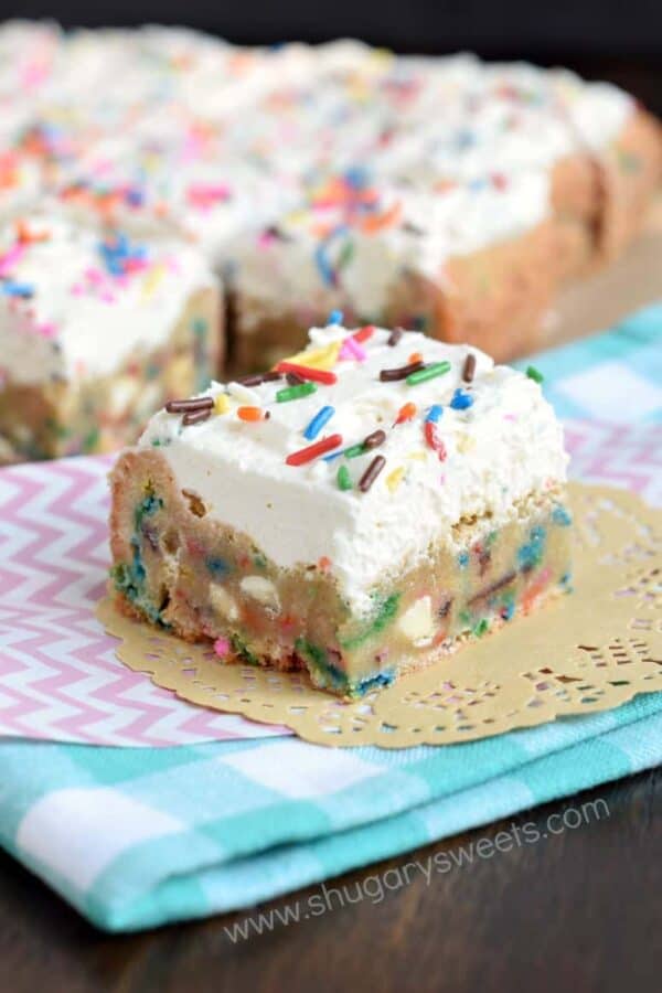 Frosted Funfetti Blondies!! Chewy blondies loaded with colorful sprinkles and topped with a creamy vanilla frosting (with more sprinkles of course)! A fun treat that can be made festive with any color sprinkle.