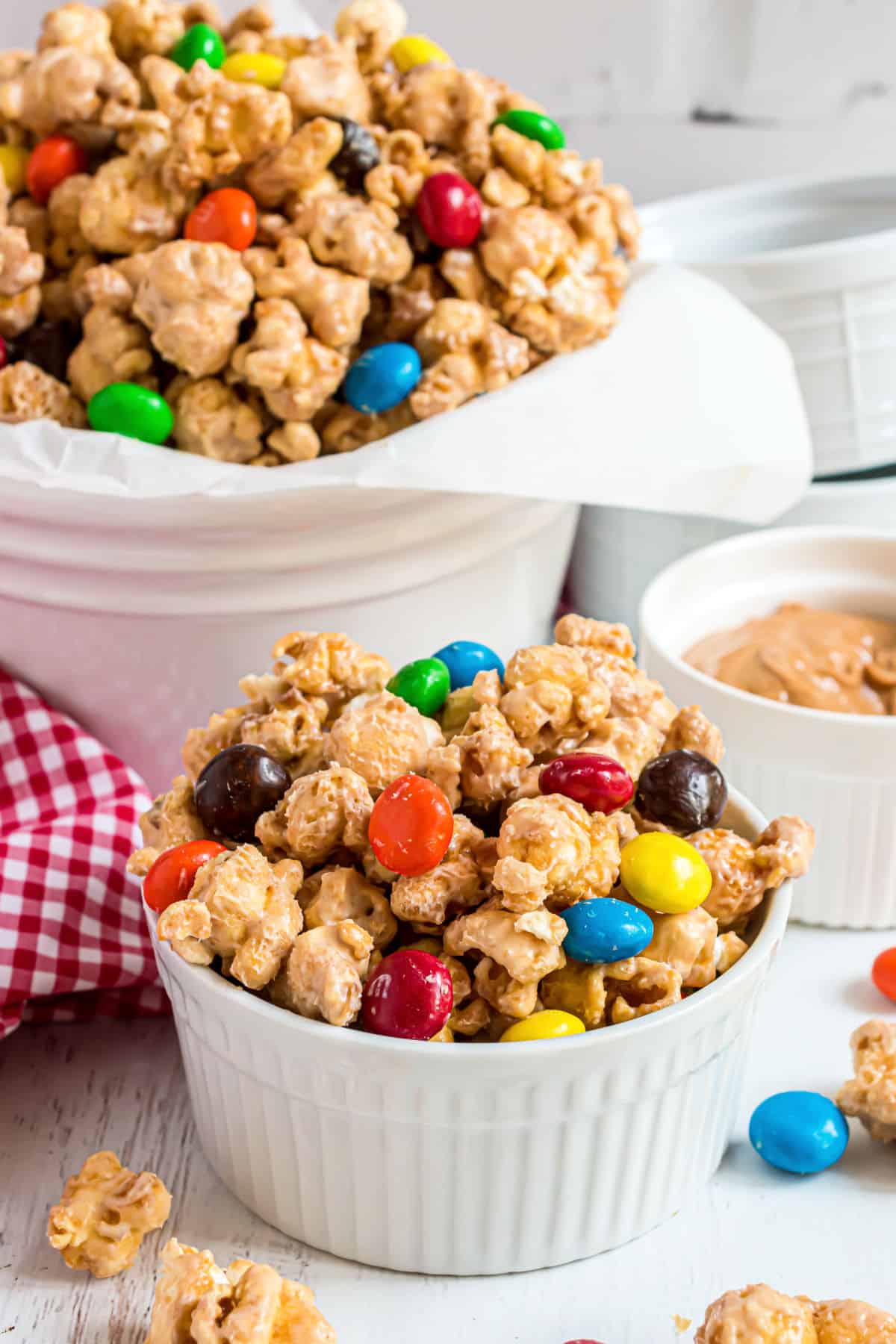 Peanut butter caramel corn served in a white bowl.