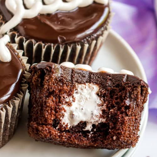 Decadent and delicious, these Copycat Hostess Cupcakes taste just like the original--only better! Fudgy cupcakes with a creamy filling and classic squiggle on top make everyone feel like a kid again.