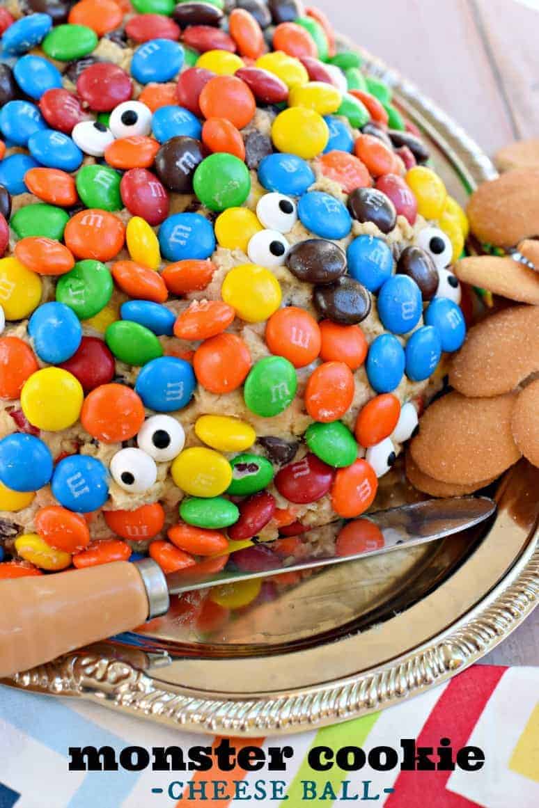 Sweet monster cookie cheeseball covered in m&m candies and candy eyes.