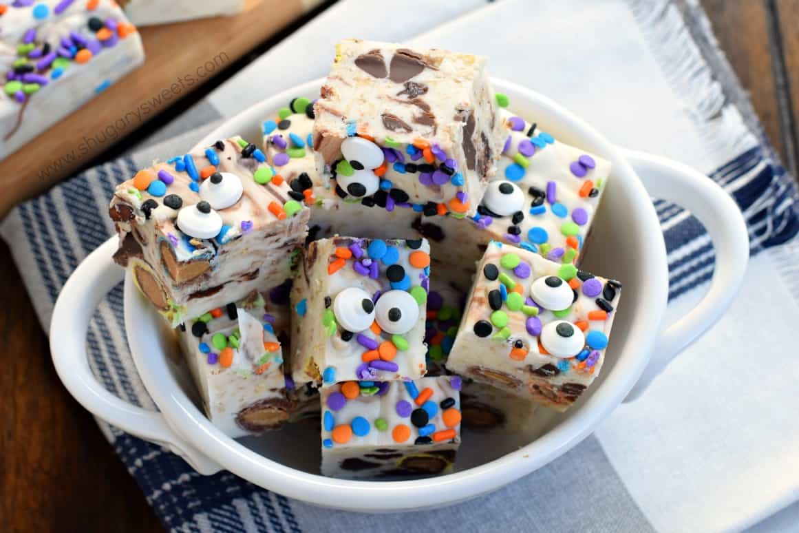 White oval bowl with pieces of monster cookie dough fudge.