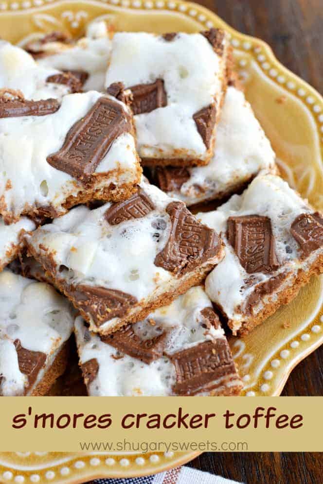 Toffee topped with marshmallows and chocolate on a yellow plate.