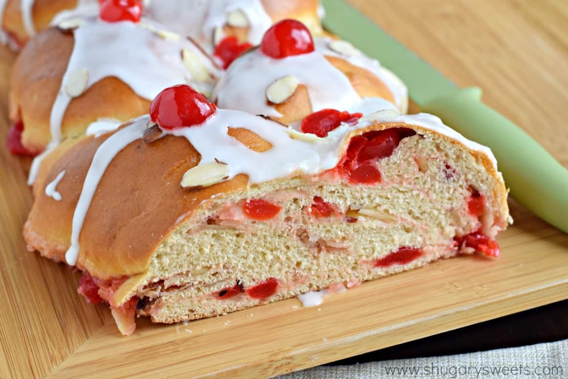 Cherry almond braid with a slice removed.