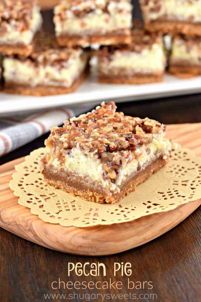 Square piece of pecan pie cheesecake on a doily.