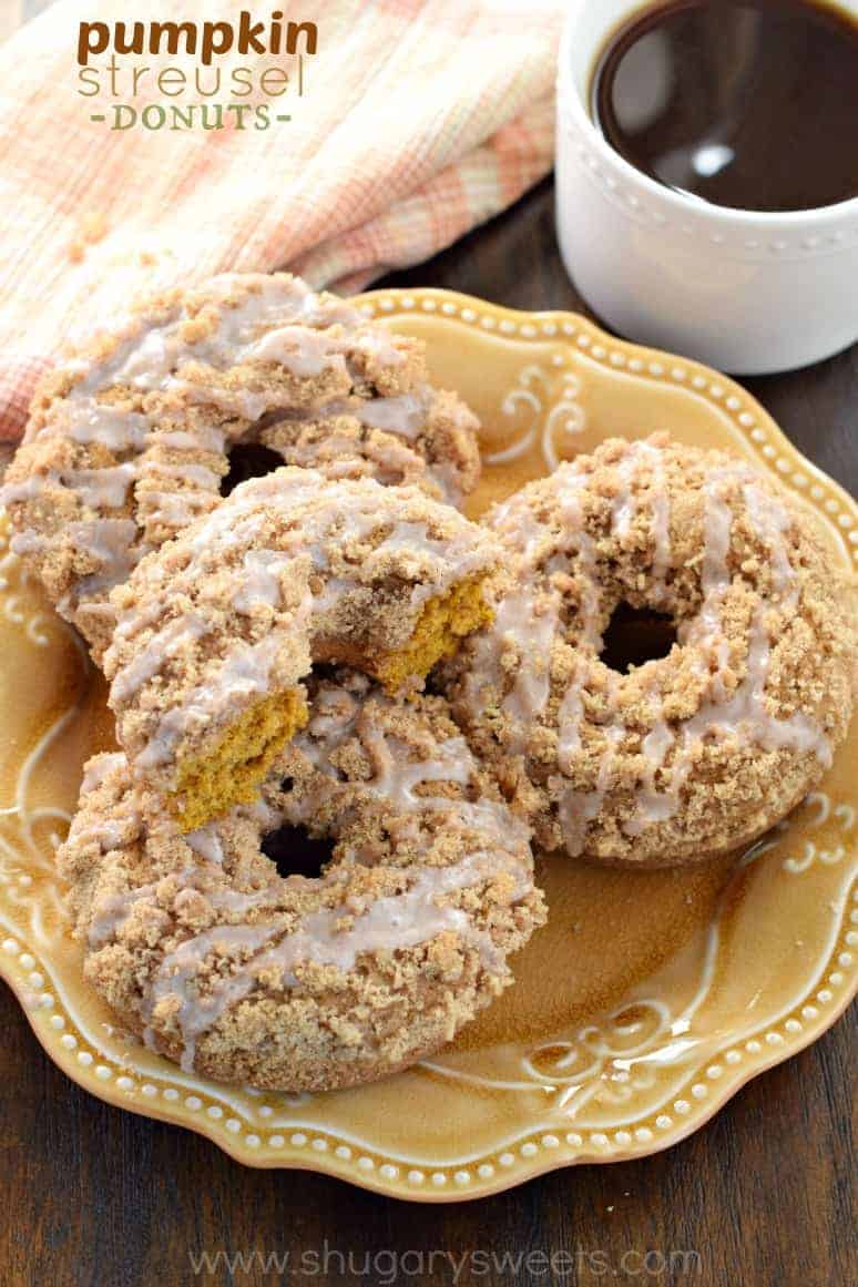 Pumpkin streusel donuts on a yellow plate.