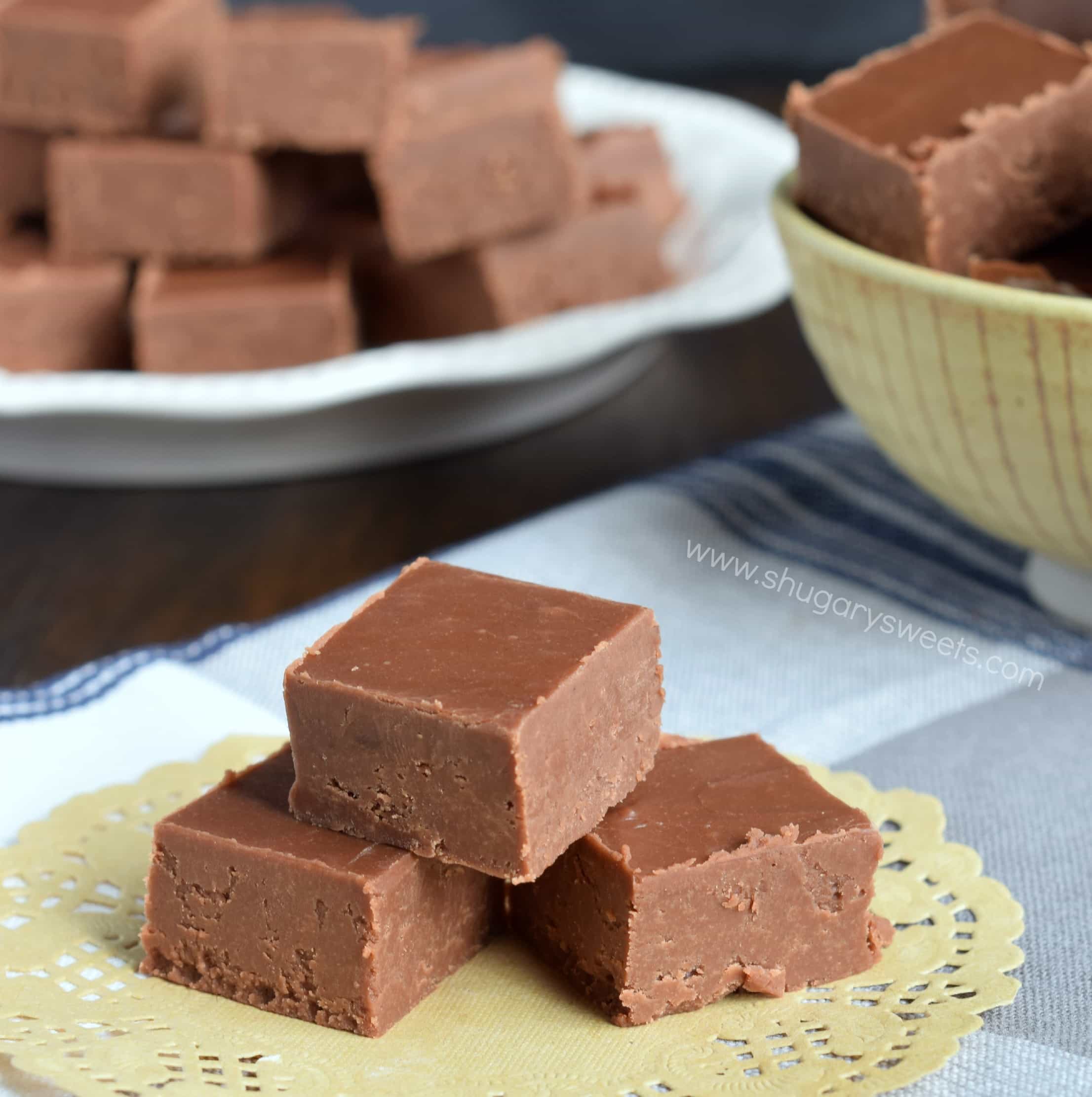 THree pieces of chocolate fudge on a doily.