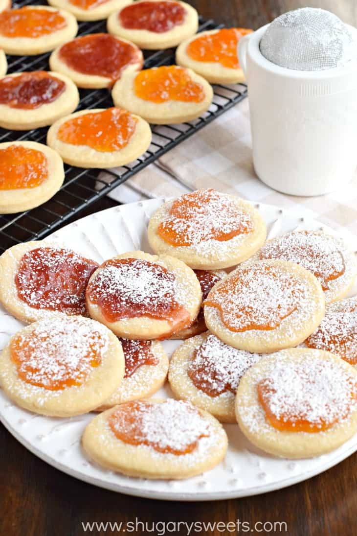 Kolachky cookies on plate with powdered sugar.