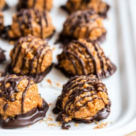 If you love Caramel deLites or Samoa Girl Scout Cookies, then these easy Samoa Truffles are going to drive your taste buds crazy! Chewy delicious candy made from scratch, no girl scout cookies needed.