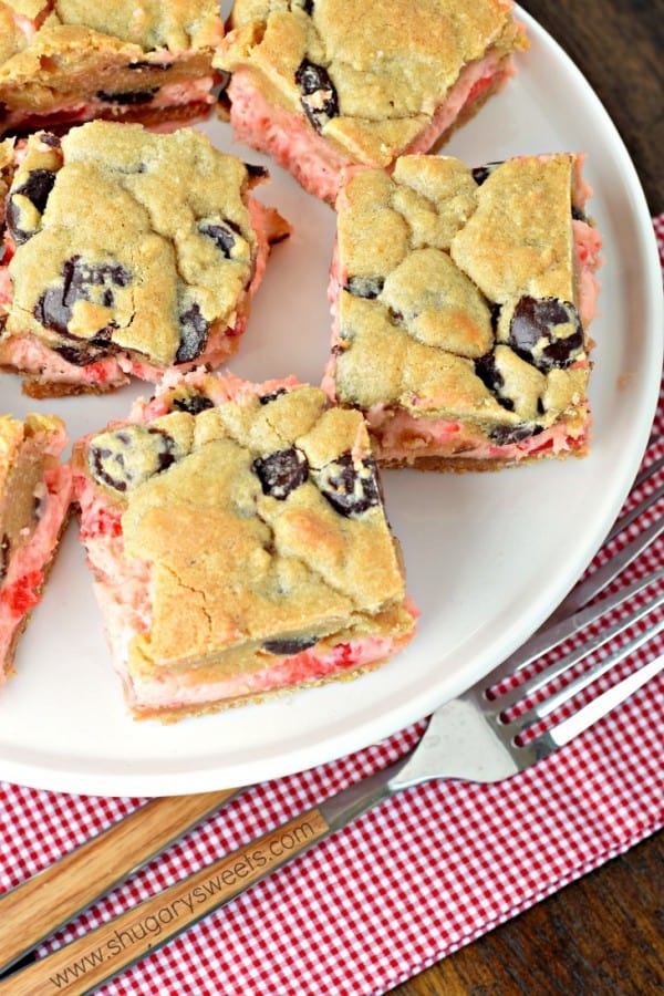 These Cherry Chocolate Chip Cheesecake Bars have a vanilla cookie crust and a creamy cherry cheesecake filling! But, don't forget about the sweet chocolate chip cookie topping to take this recipe to the next level of deliciousness!
