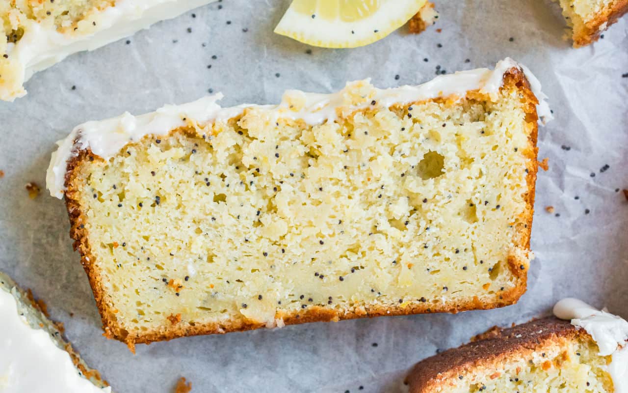 Lemon Poppy Seed Bread is a delicious easy quick bread recipe with a lemon cream cheese frosting! Every slice of this moist loaf delivers tangy lemon flavor and the perfect amount of sweetness.