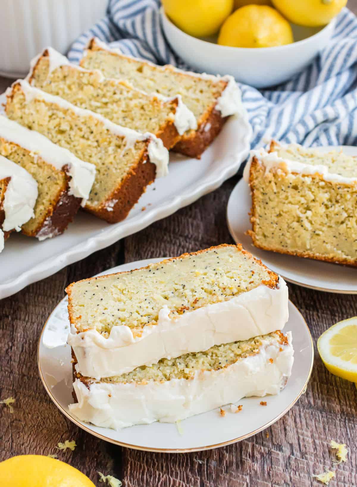 Lemon poppy seed bread on a white plate to serve.