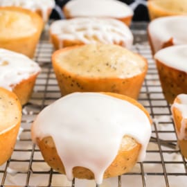 Lemon Poppy Seed Muffins are soft and fluffy on the inside with a burst of citrus flavor. Topped with a lemon glaze to give them moisture, and a lemon icing to add a pop of sweetness.