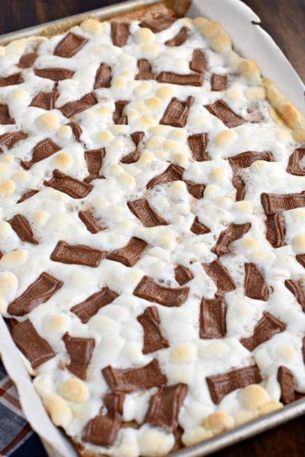 This S'mores Cracker toffee recipe has a graham cracker toffee base topped with gooey marshmallows and melted chocolate bars!