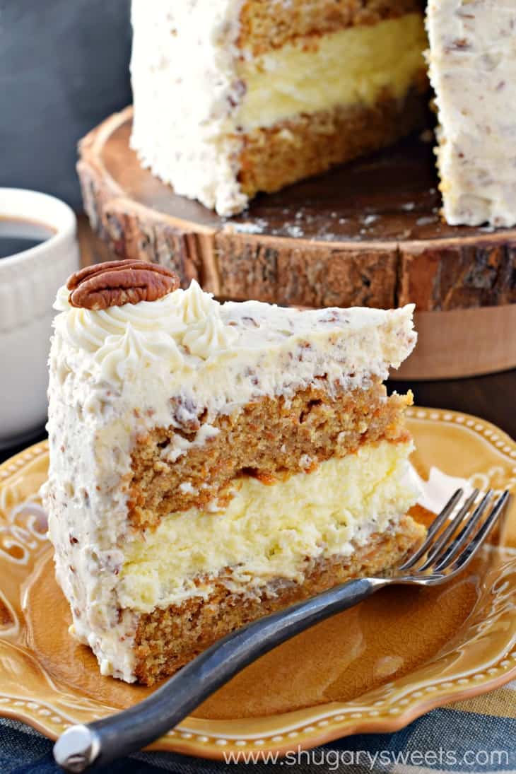 Slice of Carrot Cake Cheesecake Cake on a yellow plate.