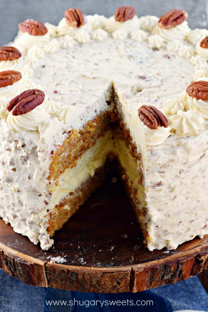 Carrot Cake Cheesecake Cake Cream Cheese Frosting with one slice removed.