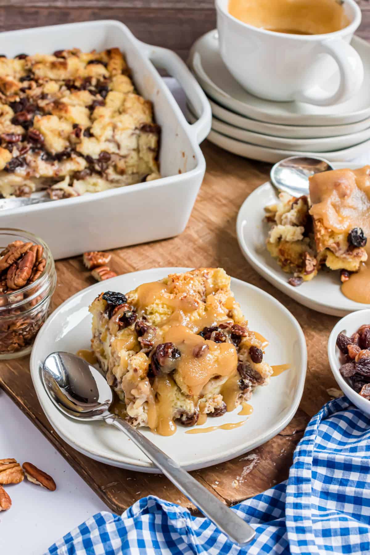 Plates of bread pudding served with caramel sauce.