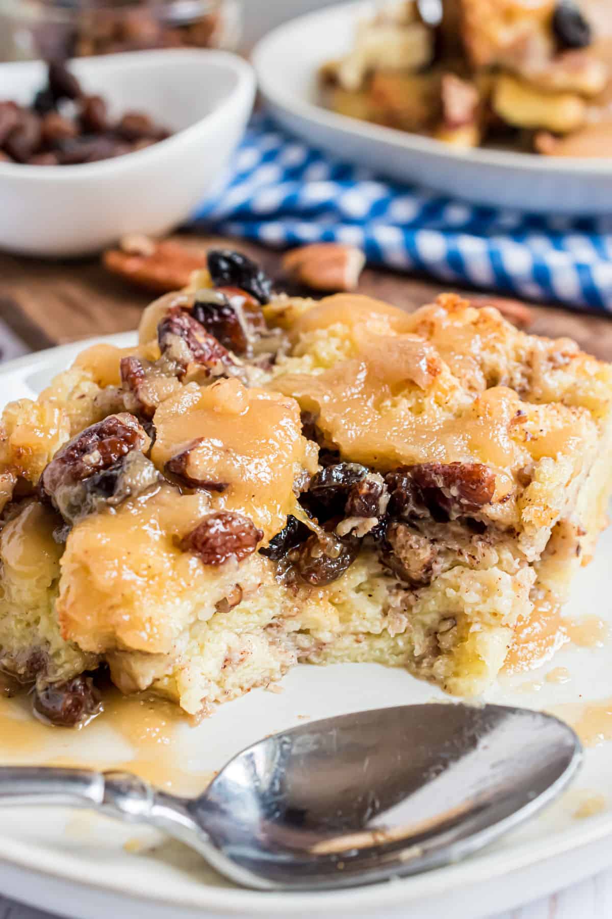 SLice of bread pudding with a bite taken out.