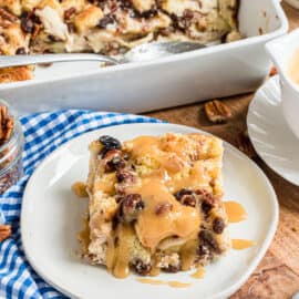 Caramel Bread Pudding has a perfect custard pudding center with a crisp outer crust! Packed with flavor and topped with caramel sauce, this dessert is the stuff dreams are made of.