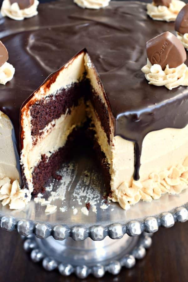 This stunning Chocolate Peanut Butter Cheesecake Cake has layers of homemade chocolate cake and peanut butter cheesecake. Topped with a creamy peanut butter frosting and dark chocolate ganache, this cake is sure to satisfy that sweet tooth!