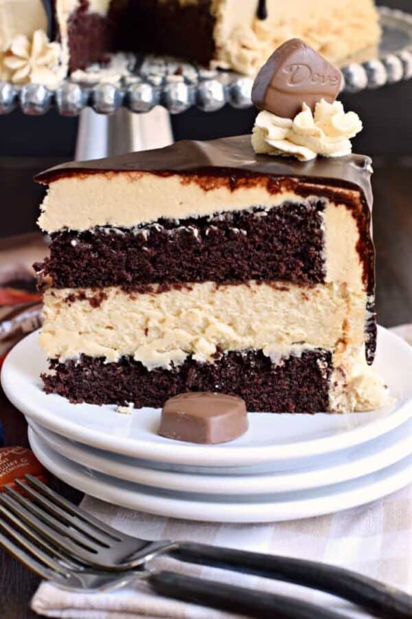 This stunning Chocolate Peanut Butter Cheesecake Cake has layers of homemade chocolate cake and peanut butter cheesecake. Topped with a creamy peanut butter frosting and dark chocolate ganache, this cake is sure to satisfy that sweet tooth! This stunning Chocolate Peanut Butter Cheesecake Cake has layers of homemade chocolate cake and peanut butter cheesecake. Topped with a creamy peanut butter frosting and dark chocolate ganache, this cake is sure to satisfy that sweet tooth!