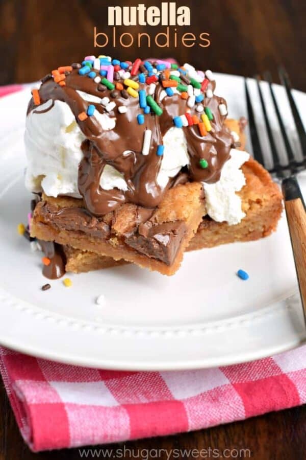 Easy, chewy, Nutella Swirled Blondies. Topped with ice cream, melted Nutella and sprinkles! Perfect way to celebrate that special occasion!