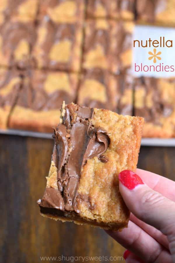 Easy, chewy, Nutella Swirled Blondies. Topped with ice cream, melted Nutella and sprinkles! Perfect way to celebrate that special occasion!