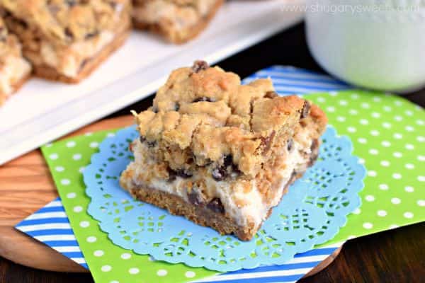 Soft and chewy oatmeal raisin cookie on top of a creamy cheesecake bar! These Oatmeal Raisin Cookie Cheesecake Bars are delicious, comfort food treats!