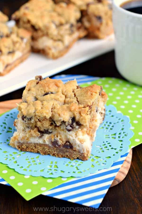 Soft and chewy oatmeal raisin cookie on top of a creamy cheesecake bar! These Oatmeal Raisin Cookie Cheesecake Bars are delicious, comfort food treats!